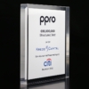 Clear acrylic financial tombstones with black text highlighting a structured debt deal for "ppro" worth €80,000,000, with kreos capital, citi, and december 2022 mentioned.