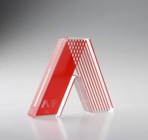 Clear acrylic recognition aard with red graphics printed