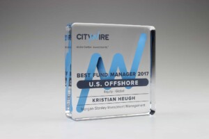 A transparent recognition award with blue graphics, reading "citywire - best fund manager 2017 u.s. offshore, kristian heugh, morgan stanley investment management.