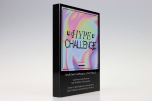 A recognition award titled "hyped challenge" is displayed against a plain background, featuring a psychedelic, colorful cover design with bold text overlay.