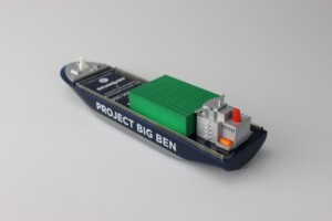 Deal toys model of a cargo ship named "project big ben" featuring a small block structure on deck, positioned on a plain white background.