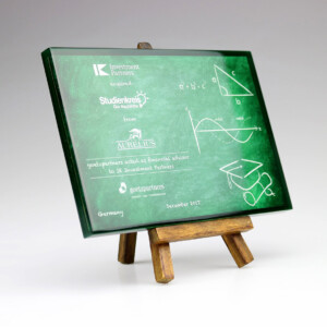 A small chalkboard on a wooden easel displaying mathematical equations and geometry diagrams, with deal toys logos and text indicating an academic or corporate sponsorship.