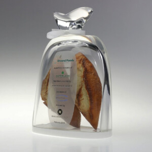 Acrylic bread bag deal toys, containing a sliced baguette. a label on the baguette indicates a business acquisition by waterland from diversi foods, advised by houlihan lokey in february 2018.