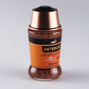 A replica coffee container of intense strauss coffee with a dark brown label, full of coffee granules, and a copper-colored lid, set against a light grey background.