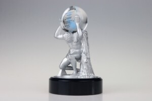Figurine deal toys featuring a muscular warrior lifting a crystalline globe overhead, set on a circular black base. the warrior is depicted in a dynamic, triumphant pose.