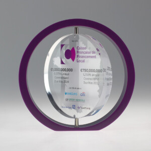 Transparent circular financial tombstones with financial details and logos, encased in a purple circular frame, placed against a grey background.