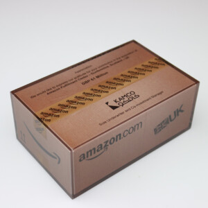 Closed amazon shipping box financial tombstones with visible branding and packaging tape, placed on a plain white background.