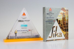 A group of financial tombstones on a table.