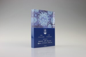 Clear acrylic financial tomstones with a 3d depiction of a virus and various texts including medical references, standing upright on a gray background.